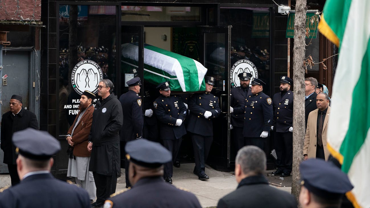 NYPD officer Adeed Fayaz's casket is carried from the Al-Rayaan Muslim Funeral Service to his funeral at the Makki Masjid Muslim Community Center on Thursday in Brooklyn. NYPD officer Adeed Fayaz's casket is carried from the Al-Rayaan Muslim Funeral Service to his funeral at the Makki Masjid Muslim Community Center on Thursday in Brooklyn.