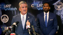 Interim Atlanta Police Foundation President and CEO Dave Wilkinson speaks at a press conference at the Fulton County courthouse in June 13 as Mayor Andre Dickens looks on.