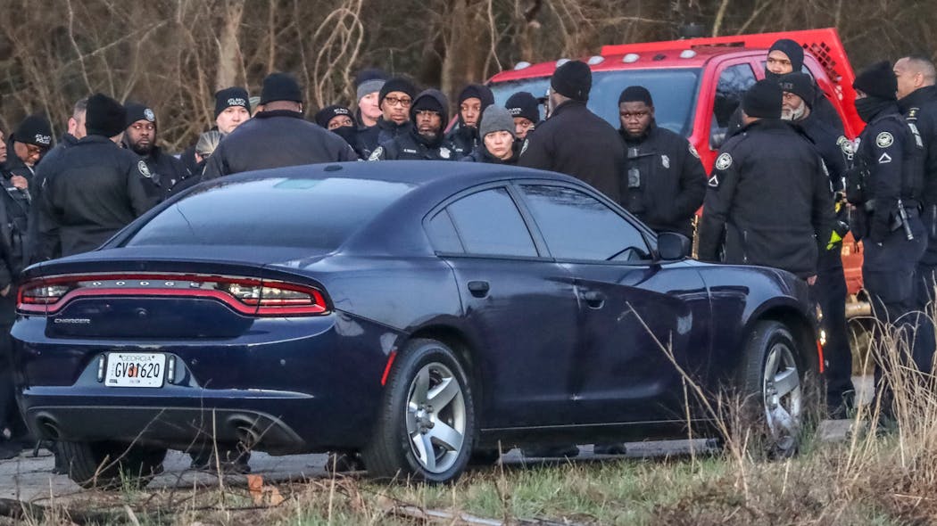 Atlanta law enforcement members patrol the site of the city's proposed public safety training center Feb. 6, clearing the woods in anticipation of construction on the controversial facility beginning in earnest.