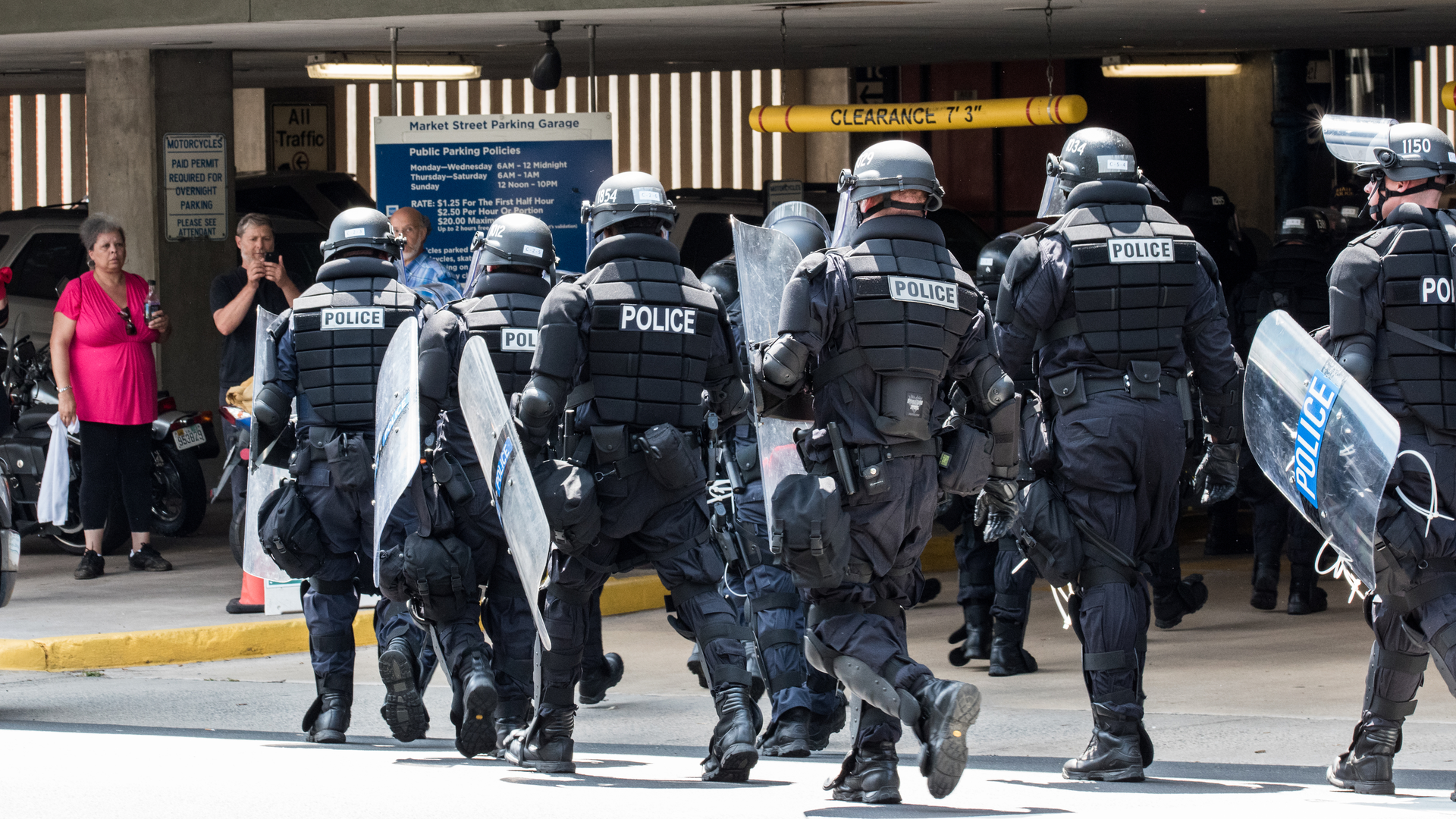 Virginia State Police form in front of a parking garage after a fight clears up to secure an area in Charlottesville in August 2017.