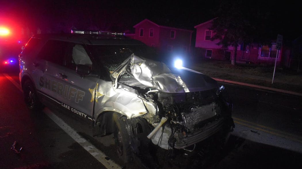 A Lake County, IL, sheriff's deputy was seriously injured Sunday when her cruiser collided with a pickup truck that was running a stop sign while the driver was opening a can of beer.
