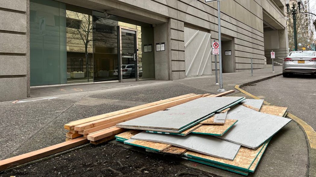Plywood boards covering the windows and glass doors of the Portland Police Bureau s Central Precinct came down Wednesday.