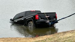 Tarrant County, TX, sheriff's deputies rescued a woman from a submerged pickup truck after she accidentally drove the vehicle into a pond Tuesday. Tarrant County, TX, sheriff's deputies rescued a woman from a submerged pickup truck after she accidentally drove the vehicle into a pond Tuesday.