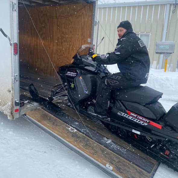 A member of the Erie County Sheriff's Office's Special Division deploys a snowmobile during the Christmas week blizzard that hammered the area. A member of the Erie County Sheriff's Office's Special Division deploys a snowmobile during the Christmas week blizzard that hammered the area.