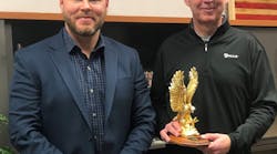 ASP Mideast US Sales Director Aaron Hill (l.) presents Premier Partner Award to Galls CEO Mike Fadden (r.).