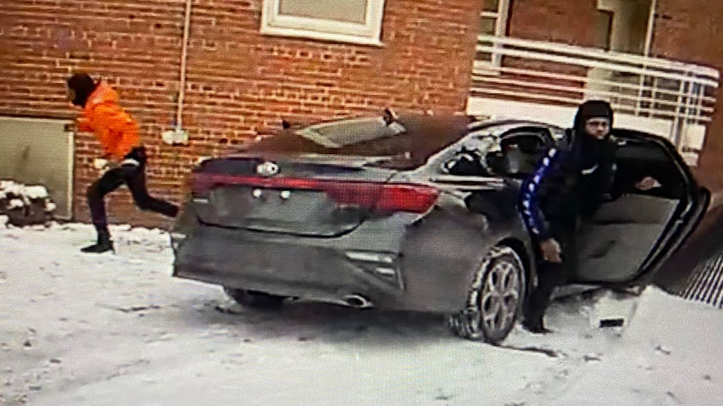 Two suspects are seen fleeing following a shooting that left a Cleveland police detective wounded Tuesday.