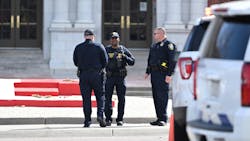 Denver police investigate the scene of a shooting at East High School on Wednesday that left two deans wounded. Denver police investigate the scene of a shooting at East High School on Wednesday that left two deans wounded.