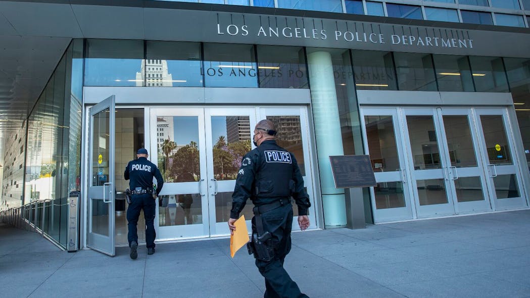 Members of the LAPD make their way into downtown headquarters in Los Angeles. Members of the LAPD make their way into downtown headquarters in Los Angeles.