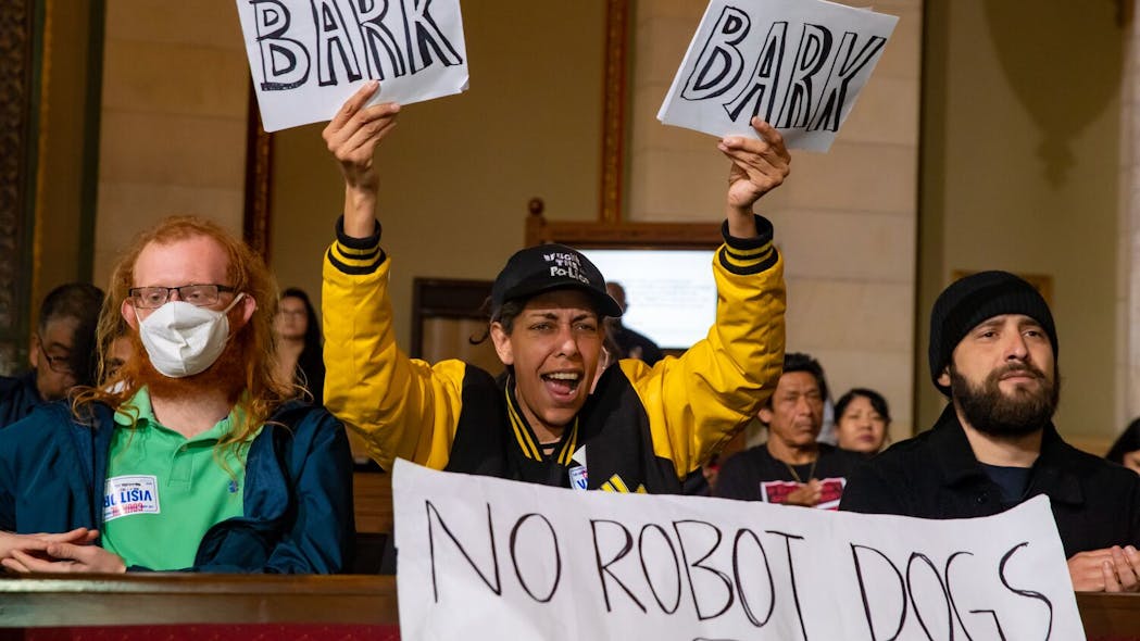 An audience member Tuesday voices her opposition to the donation of a robot dog to the LAPD.