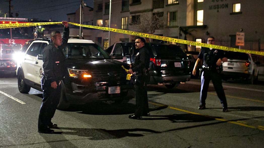 The LAPD secures the scene where three officers were shot in Lincoln Heights on Wednesday in Los Angeles.