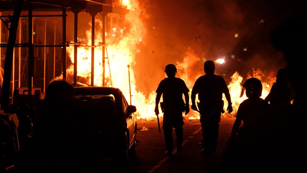 NYPD officers and FDNY firefighters respond after protesters set a large fire in Manhattan, New York City during a protest against police brutality and the death of George Floyd in 2020. NYPD officers and FDNY firefighters respond after protesters set a large fire in Manhattan, New York City during a protest against police brutality and the death of George Floyd in 2020.