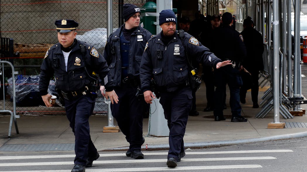 NYPD officers provide security outside the Manhattan District Attorney's office in New York City on Friday after a grand jury voted to indict former President Donald Trump. NYPD officers provide security outside the Manhattan District Attorney's office in New York City on Friday after a grand jury voted to indict former President Donald Trump.