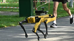 A man jogs past a four-legged robot called Spot at the Bishan-Ang Moh Kio Park in Singapore in 2020. A man jogs past a four-legged robot called Spot at the Bishan-Ang Moh Kio Park in Singapore in 2020.
