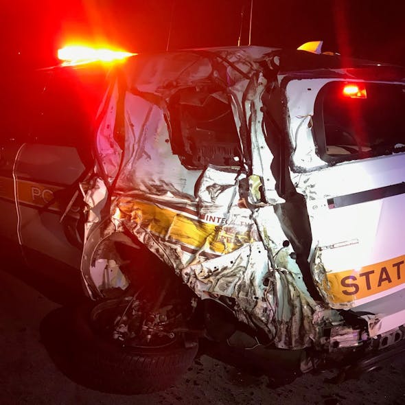An Illinois State Police trooper was injured when a Mack truck drove through barricades at a Champaign County construction zone early Wednesday and crashed into the trooper's cruiser.