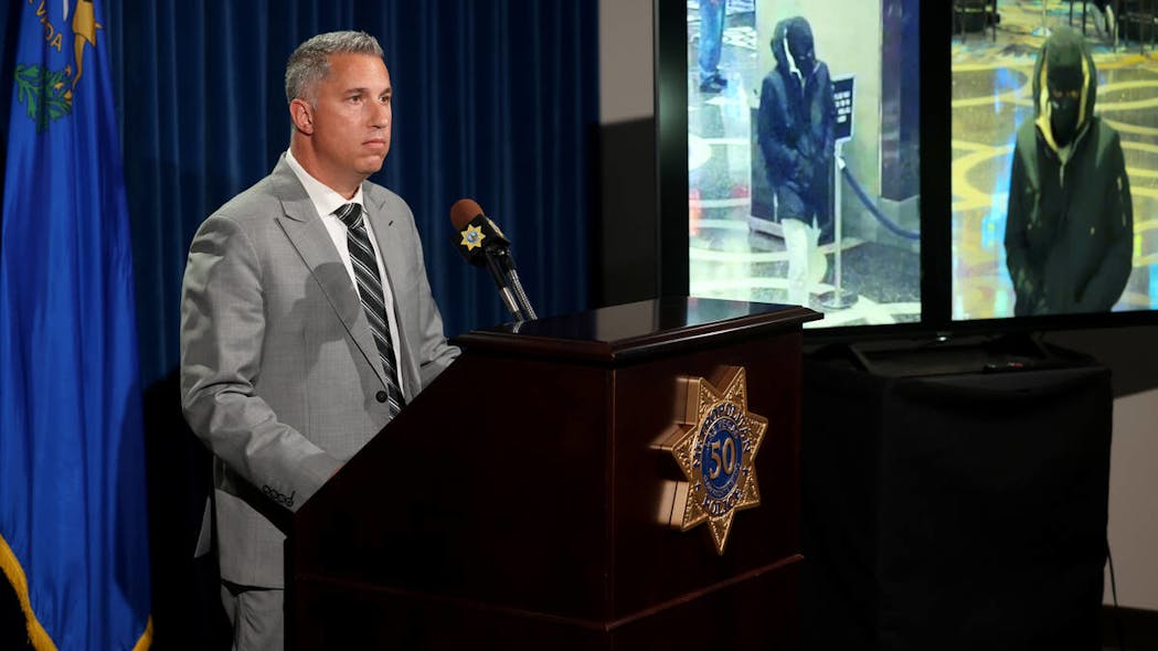 Deputy Chief Nicholas Farese shows surveillance images of a casino robbery suspect during a news media conference at Las Vegas police headquarters April 20.