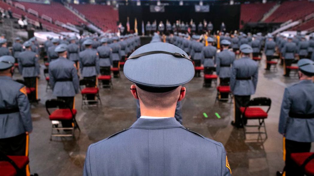A recruit stands with others during the start of the graduation ceremony for the 144 cadets of the 161st New Jersey State Police class in 2021 at the Prudential Center in Newark. A recruit stands with others during the start of the graduation ceremony for the 144 cadets of the 161st New Jersey State Police class in 2021 at the Prudential Center in Newark.
