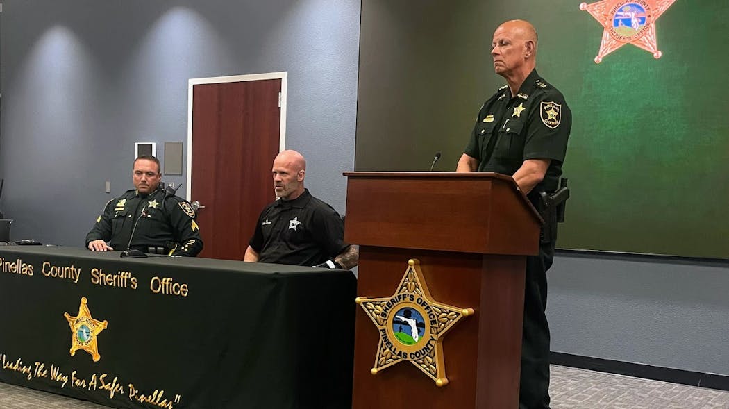Pinellas County, FL, Sheriff's Office Sgt. Jake Viano (left), Cpl. Matthew Aitken (center) and Sheriff Bob Gualtieri talk at a news conference at the agency's headquarters in Largo on Thursday.