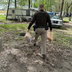 Hancock County, IN, Sheriff's Deputy Josh Cochard delivered groceries for a woman on April 20. He had stopped her while she was traveling an unsafe route to the store on her electric scooter. Hancock County, IN, Sheriff's Deputy Josh Cochard delivered groceries for a woman on April 20. He had stopped her while she was traveling an unsafe route to the store on her electric scooter.