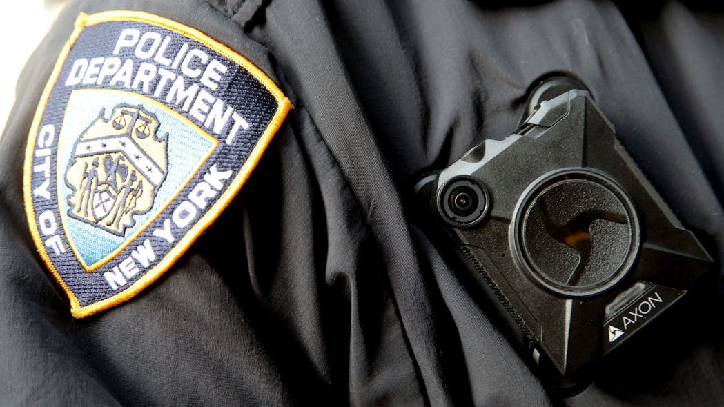 A NYPD officer wears a body camera on his jacket in Midtown Manhattan in 2019.