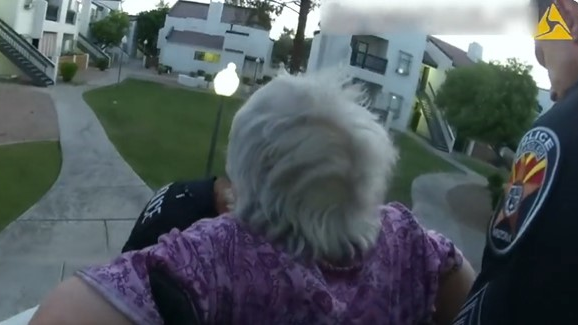 Chandler, AZ, police helped an elderly woman with a walker escape a burning apartment building June 18, carrying her down stairs to safety,