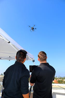 Two members of the Chula Vista Police Department are seen monitoring a drone as part of the agency&apos;s Drone as First Responder (DFR) program.
