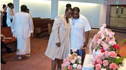 Antoinette Edwards embraces Lakeesha Dumas as they look at the casket for &apos;Baby Precious&apos; at the end of a June 2013 memorial service at Maranatha Church in Portland, Ore.