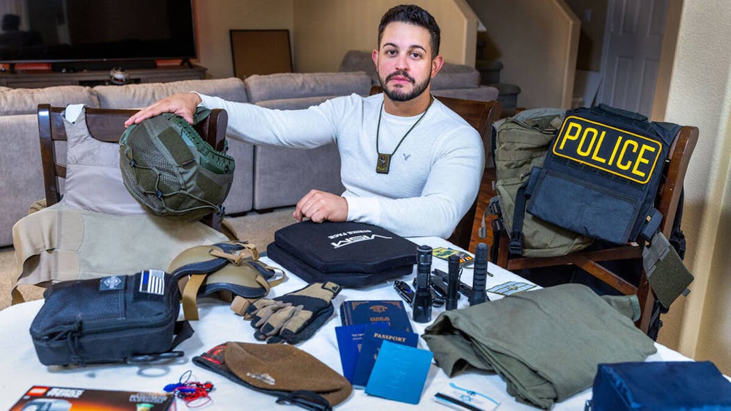 Las Vegas Police Officer Ariel Salley sits with the gear he will bring with him to Israel when he rejoins the Israel Defense Forces in the fight against militants following the terrorist attacks by Hamas against country earlier this month.