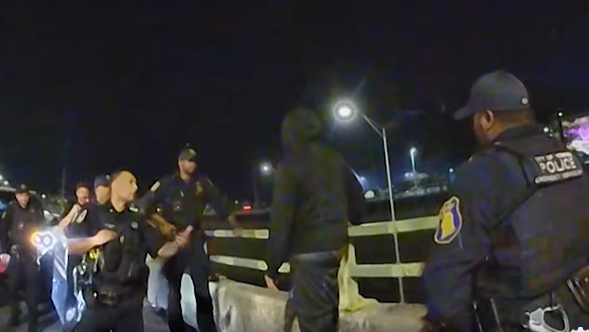 Yonkers, NY, police rescued a man in distress who tried to jump off an overpass guardrail on Oct. 19.