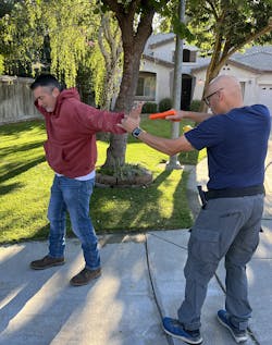 An Officer can enter an extended wrist lock one-handed. The goal is to be able to have full control before holstering, or transitioning to another status.