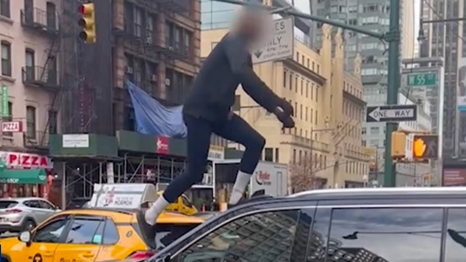 Man steals car in NYC, crashes into taxi, climbs onto moving SUV during police chase