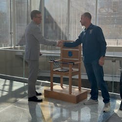 Bill Alexander, Chief Executive Officer for the National Law Enforcement Officers Memorial Fund, left, is seen with Tommy Capell, the Executive Director of Saving a Hero&rsquo;s Place, during the unveiling of an honor chair built for the National Law Enforcement Museum on Oct. 25.