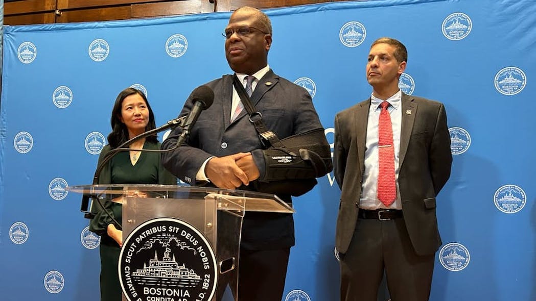 Boston Police Commissioner Michael Cox (center) speaks at a press conference at Boston City Hall, flanked by Mayor Michelle Wu (left) and Boston Police Patrolman&apos;s Association President Larry Calderone (right) after the city and its largest police union agreed to a new contract, Monday.