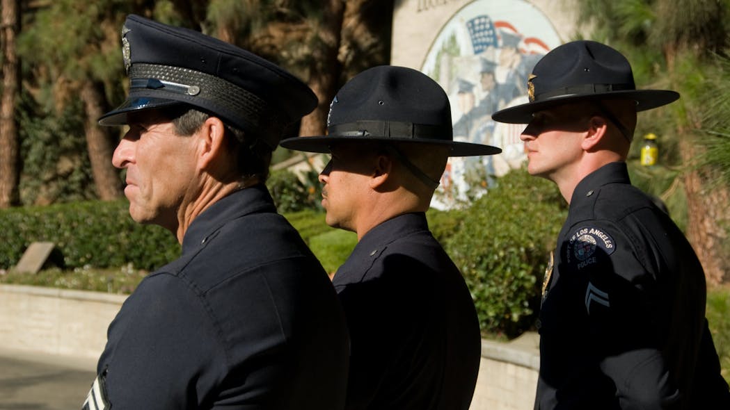 Instructors look on during LAPD graduation.