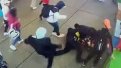 A group of NYPD officers were trying to break up a disorderly crowd outside a Times Square migrant shelter Jan. 27, and when they attempted to put one of the men under arrest, multiple people attacked the officers.