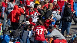Fans scatter when gunfire erupts during a mass shooting during the Kansas City Chiefs&apos; Super Bowl victory rally on Feb. 14.