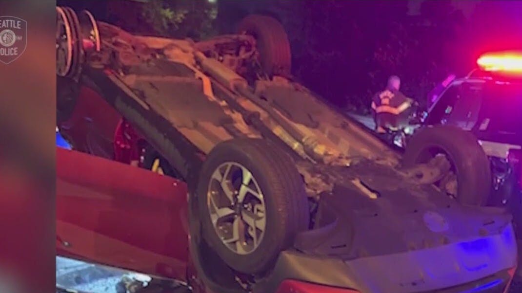 WATCH: Stolen car flips onto Seattle Police car
