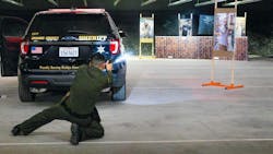Orange County, CA, Sheriff s Deputy Darwin Nip demonstrates training that mirrors real-life situations at the firearms training center in Orange.