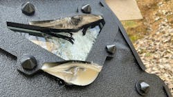 The viewport is seen after three .223 rounds were fired on it. Two hit the frame; one hit directly on glass. There was no penetration. The viewport is seen after three .223 rounds were fired on it. Two hit the frame; one hit directly on glass. There was no penetration.