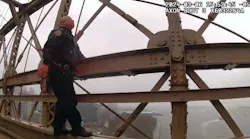 NYPD Lt. Hak Kim scales the rain-slickened Brooklyn Bridge on March 6 to rescue a woman who climbed the bridge and threatened to jump.