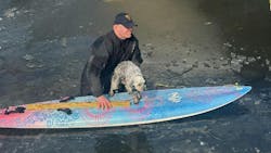 New Jersey State Police Trooper Michael Betz grabbed a paddleboard and a drysuit to rescue a frightened dog trapped on an icy lake last month.