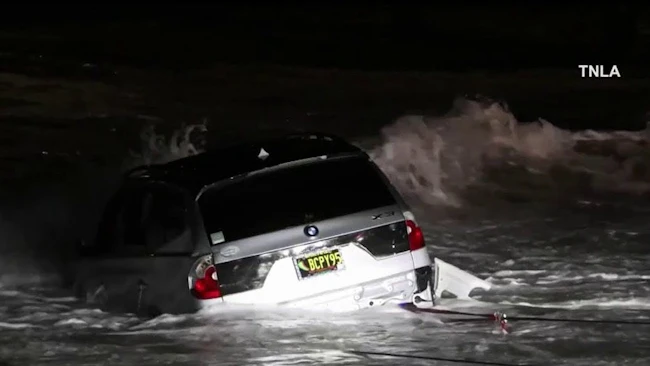 Woman arrested after driving car into ocean during pursuit