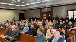 Officers and detectives with the Lexington Police Department fill the courtroom gallery Monday during a preliminary hearing against three men charged with shooting an officer.