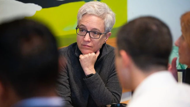 Oregon Governor Tina Kotek sits with colleagues at Kafiex Roasters on the Vancouver, WA waterfront on Tues., Feb. 13, 2024.