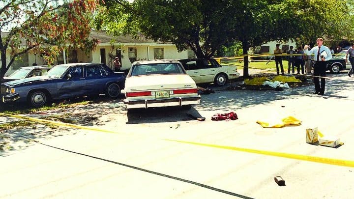 A crime scene photograph of the shootout's aftermath shows the suspects' and agents' vehicles, a dropped shotgun, and debris.