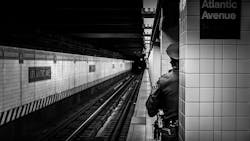 An NYPD transit officer stands on the subway platform at the Atlantic Avenue station in Brooklyn in 2020.