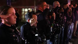 Police officers from several agencies gather at Upstate University Hospital s emergency room in Syracuse, NY, and stand at attention after two officers were fatally shot in Salina on Sunday.