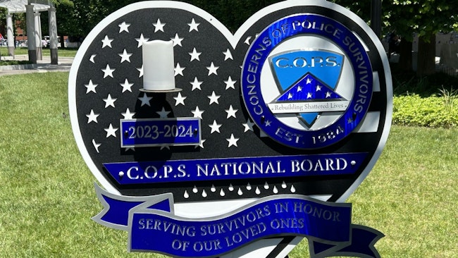 A sign displayed at National Law Enforcement Officers Memorial in Washington, D.C., during National Police Week on Monday.