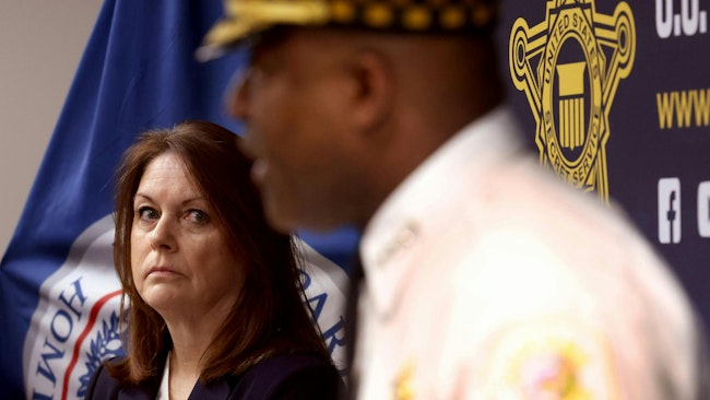 Secret Service Director Kimberly Cheatle listens to Chicago Police Superintendent Larry Snelling discuss preparation efforts Tuesday ahead of the Democratic National Convention in the city.