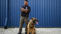 K-9 Falco sits with Gary handler Cpl. Angel Lozano between training sessions on June 10, 2019, for the first day of a weeklong K-9 training operation at the Multi Agency Academic Cooperative in Valparaiso. Falco was fatally shot while pursuing a suspect in July 2023.