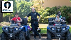 A Portland, OR, police talks with young kids at a park in August 2018. A Portland, OR, police talks with young kids at a park in August 2018.